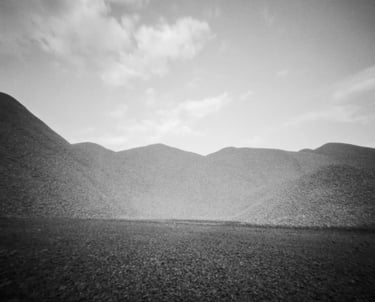 Black and white pinhole picture of mountains