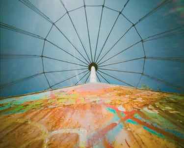 View of a water tower towering above, against a clear blue sky