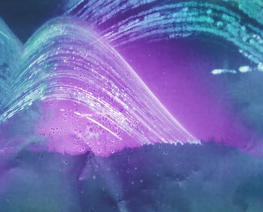 A vibrant purple and green wave against a serene blue background