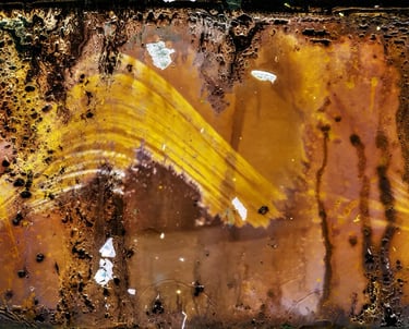 Rusty photopaper with yellow photo, weathered by sun exposure over six months