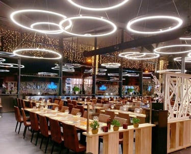 a restaurant with a long table and chairs