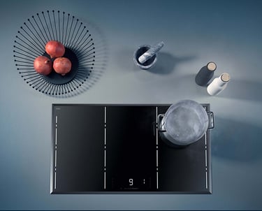 a kitchen with a bowl of apples and a bowl of apples