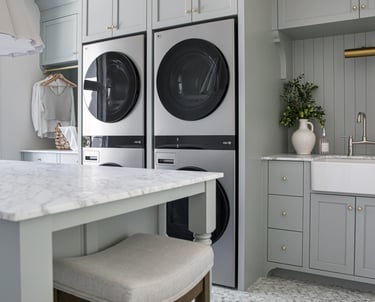 a kitchen with a sink, a sink, and a laundry room