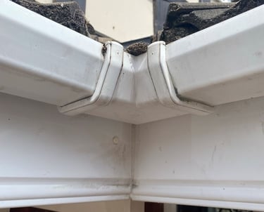 Blocked and leaking gutter corner joint