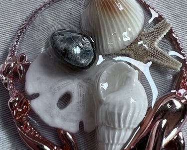 Resin pendant, colored gold with small seashells and a sand dollar