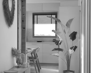 a black and white photo of a dining room