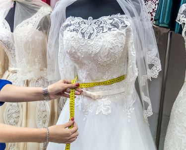 a woman measuring a dress with a measuring tape measure tape