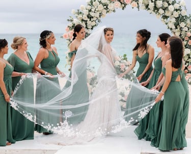a bride and groomsmid in front of a wedding ceremony