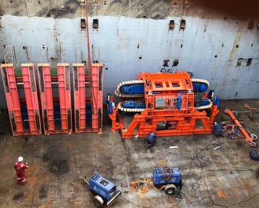 Offshore industrial equipment with workers and machinery on a ship