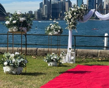 a wedding ceremony with a red carpet and a red carpet