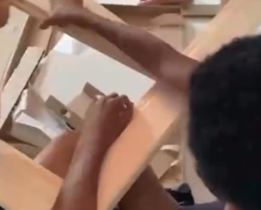 a boy putting a table together
