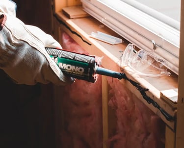 a man in a white shirt is holding a hammer and a hammer in his hand