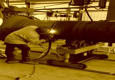 a man welding a kiln burner at Shivshakti Plant
