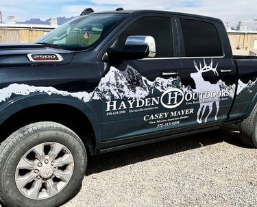 Partial truck wrap with a custom design of mountains for a local broker in Las Cruces, NM