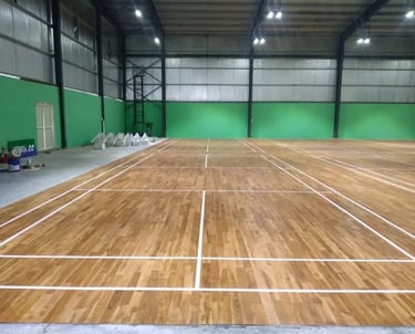 Indoor wooden badminton courts built with professional sports flooring