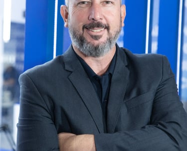 a man in a suit and tie is smiling
