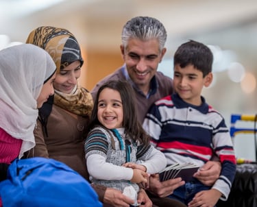 Family celebrating with Canadian travel documents, a key success for visa consultants.