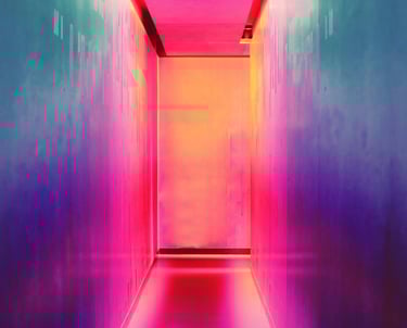 A hallway with a bright neon colored light gradients, suggesting a psychedelic journey