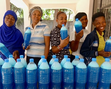 Women are happy after complete making handmade liquid soap
