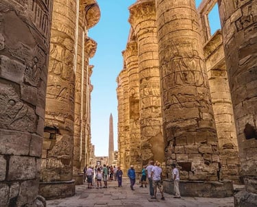 a group of people walking through a narrow alley