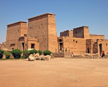 a large building with a few people standing around it
