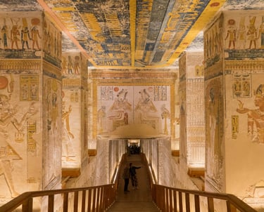 a person walking down a long hallway with a large ceiling