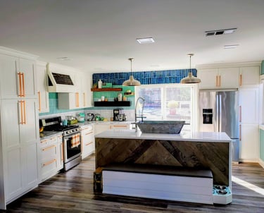 modern smart kitchen with waterfall island counter.  Custom French bath sink, storage bench, and built in dog bowl area.