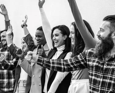 a group of people standing in a line with their hands up