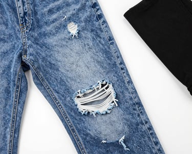 A seamstress measuring fabric to create a custom garment.