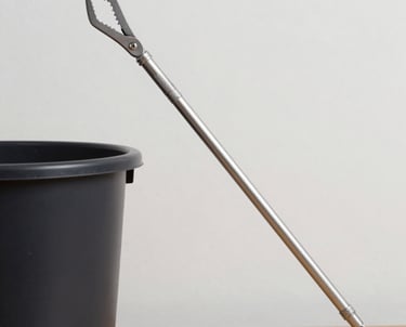 white plastic bucket on wet ground