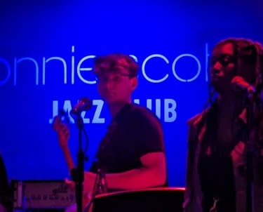 An image of Jamie Walker playing Electric Bass at Ronnie Scott's Jazz Club in London