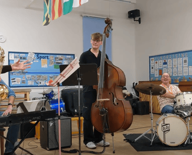 An image of Jamie Walker performing with a jazz quartet