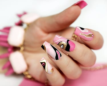 a woman's hand painted nails and nails with a pink and black nail polish