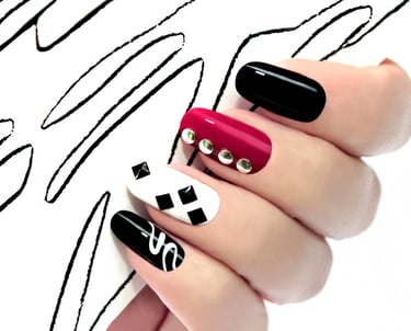 a person's hand with a black and white nail polish