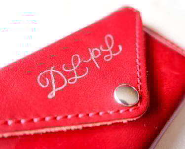 NYC custom hot foiling calligraphy on leather and card accessories by a New York calligrapher