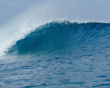 Powerful turquoise wave breaking at Telescopes in Mentawai Islands, perfect for surfing adventures.
