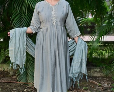 front-view of suit wearing women with trees in background