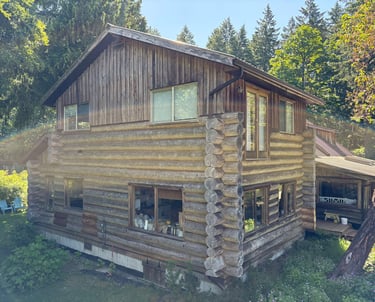 Log home in Courtenay on Vancouver Island before it was restored by Embassy Restorations 