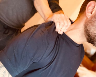 a man receiving a shoulder massage