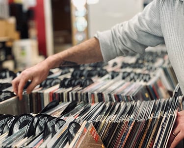 Person crate diving through vinyl records