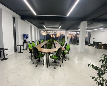 a conference room with a long table and chairs