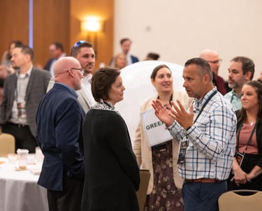 Attendees networking at Unleashing Radiance leadership event.