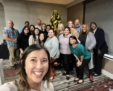 Unleashing Radiance team smiling together at a event.
