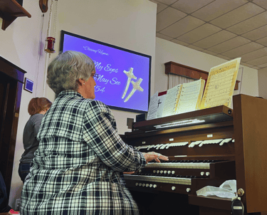 Organ being played during worship at the Moran United Methodist Church
