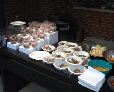 a table with bowls of food and bowls of food