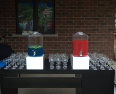 a table with drinks and glasses on it