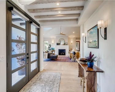 The grand entrance of a hacienda style house.