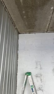 new brick repair on storage facility wall