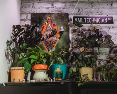 "Nail Technician DR" The Nail Witchery booth plants and decor in Fabrik Salon, downtown Missoula, MT
