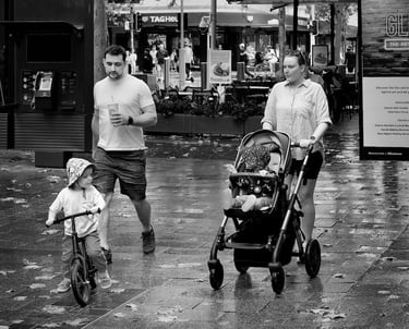 Family on a rainy day in Perth snapped by the lens of Peter Pickering